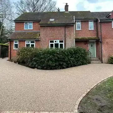 Resin bound drive in front of a brick house