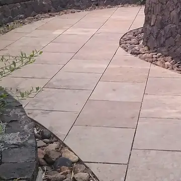 Natural stone path beside a rockery